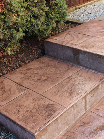 Concrete finishes including brushed, exposed, or stamped for patios and walkways