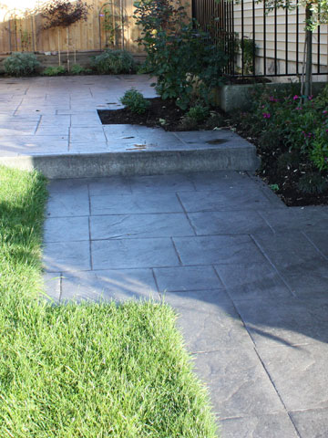 Concrete finishes including brushed, exposed, or stamped for patios and walkways